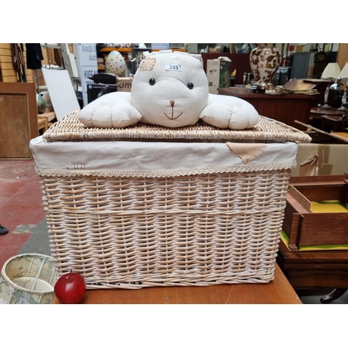 333 - A charming example of a laundry hamper with linen lining and large bunny rabbit decoration in clean ... 