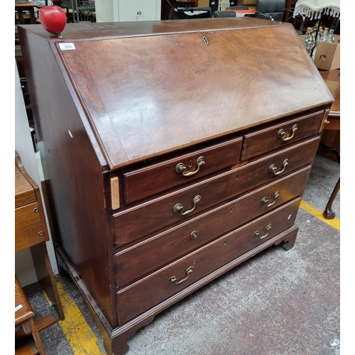 360 - A handsome example of a mahogany late Georgian writing Bureau with numerous neat-sized drawers inclu... 