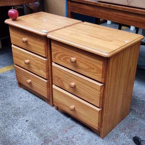 364 - A pair of  pine bedside lockers with three well-running drawers apiece.