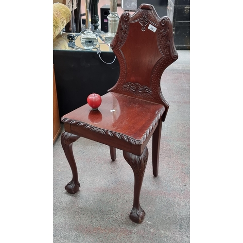 383 - A handsome shield back hall chair with ornate claw and ball feet and rope edge detailing with a serp... 