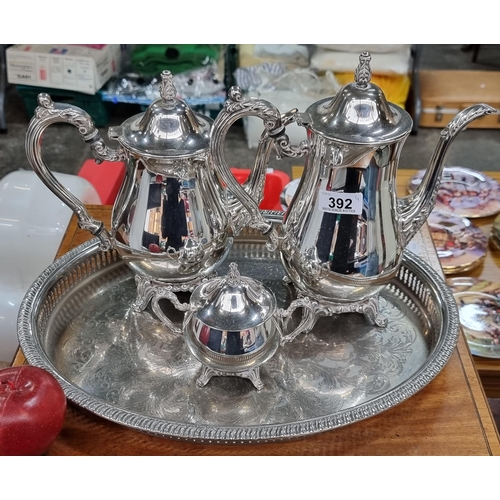 392 - A four-piece American silver plated serving set by Oneida. Including coffee pot, tea pot, tray and s... 