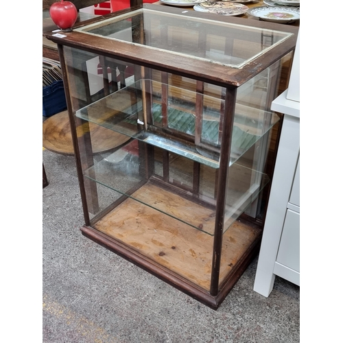 395 - Star Lot : An antique, Edwardian shop display cabinet with sliding doors to the back, with one mirro... 