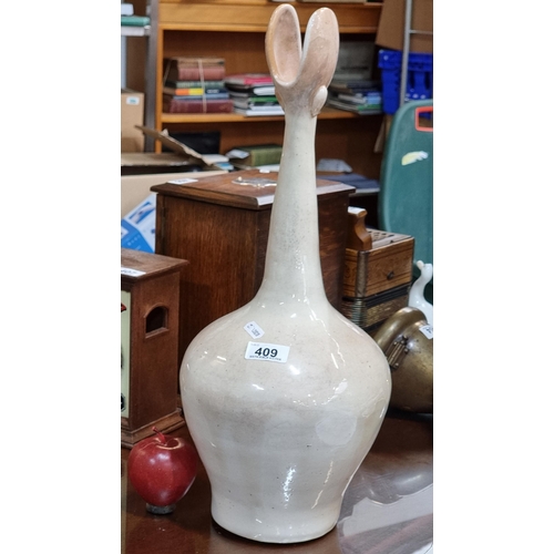 409 - A large very unique and impressive ceramic vase in a shape of a flower bud, with a cream glaze. Supe... 