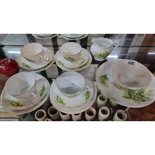 428 - A collection of fifteen china items by Victoria, featuring a floral motif in shades of green.