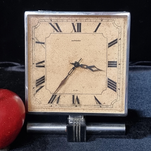 654 - An original Art Deco, free standing Garrard clock on a chrome base.