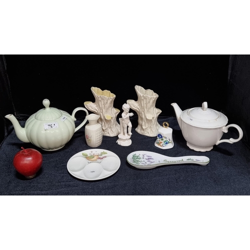 704 - Nine pretty porcelain items including a pair of Irish Belleek vases with tree trunk style form, with... 