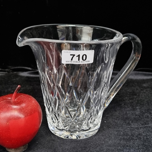 710 - A lovely heavy  Waterford Crystal water jug, with large diamond pattern and acid mark to base in gre... 