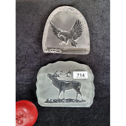 714 - A pair of striking art glass paper weights, featuring an eagle and a stag with frosted backing.