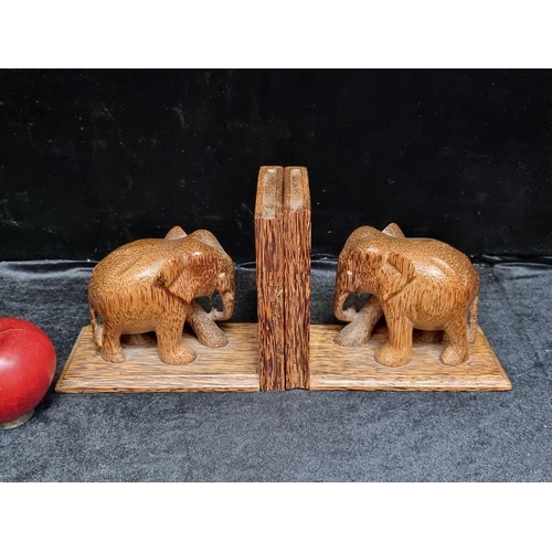 721 - A stylish pair of vintage hardwood elephant book ends.