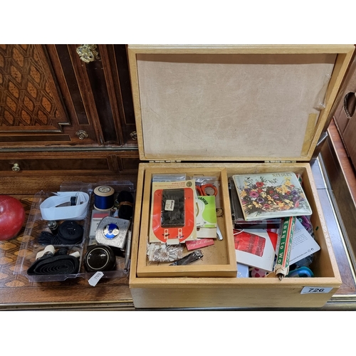 726 - A lovely sewing box with a floral pin cushion to the lid, and containing sewing related items.