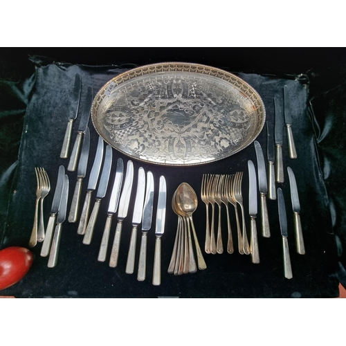 740 - A large selection of silverware, including military Sheffield knives, Newbridge spoons, and Tablewar... 