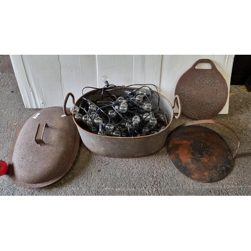 762 - A cast metal, antique pan filled with a quantity of excellent string lights. These are large bulbs a... 