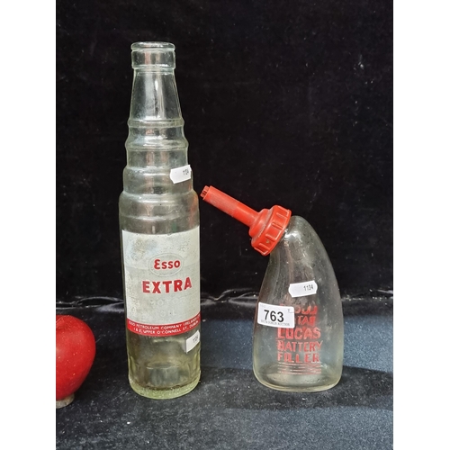 763 - Two vintage bottles, including an Irish Esso Extra example and another for Lucas Battery Filler - tw... 