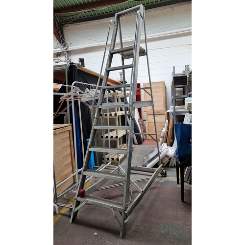 769 - A super high quality eight-step step ladder with an A frame and large casters for easy transportatio... 