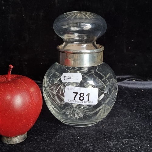 781 - A pretty, vintage cut crystal bottle with a large circular crystal pommel lid. Featuring a sterling ... 