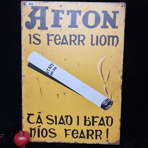 85 - A large metal advertisement for Afton cigarettes. In Irish language.