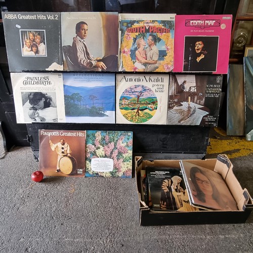 669 - A collection of thirty-eight vinyl albums, including ABBA and Paul Simon etc.