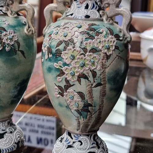 430 - A stunning pair of highly unusual Japanese stoneware vases from the Meiji era. This expertly crafted... 