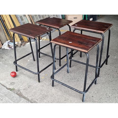 674 - Four vintage lab stools with wooden top and cast iron legs in a black finish. Super nice industrial ... 