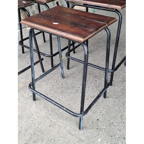 674 - Four vintage lab stools with wooden top and cast iron legs in a black finish. Super nice industrial ... 