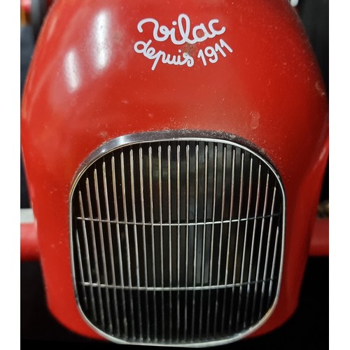 137 - A super charming Vilac brand toddler's ride on car in a vintage aesthetic, in a red colourway with f... 