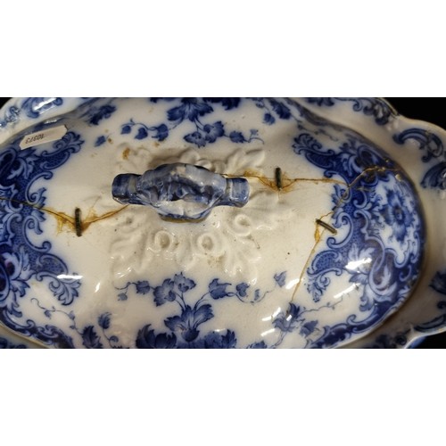 213 - A Burslem fine china soup tureen and a serving dish in blue and white pattern. Antique repairs.