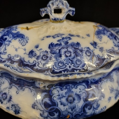 213 - A Burslem fine china soup tureen and a serving dish in blue and white pattern. Antique repairs.