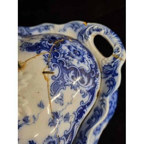 213 - A Burslem fine china soup tureen and a serving dish in blue and white pattern. Antique repairs.