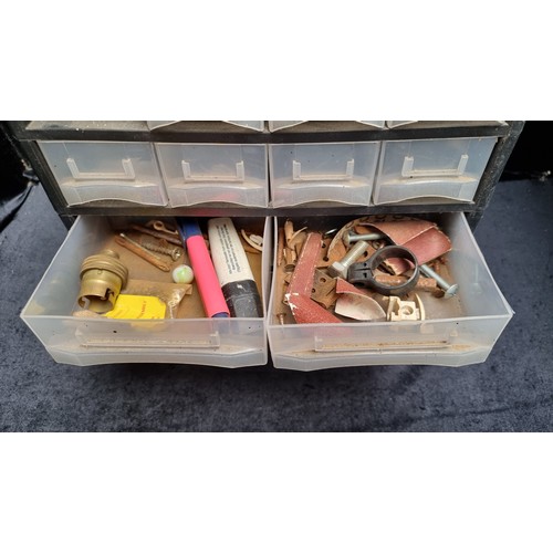 265 - A workbench tool storage cabinet with sixteen compartments, along with a collection of DIY items.