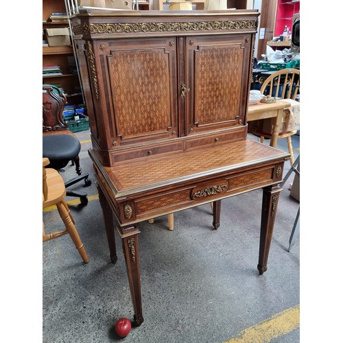 371 - Star Lot : An antique French gorgeous writing desk, with two doors to reveal shelves, and two pull-o... 