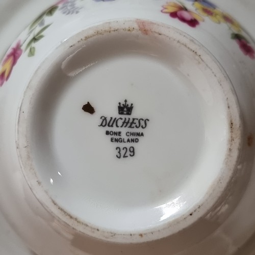 401 - A collection of twenty Dutchess bone china with a floral decoration.