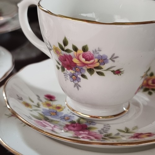 401 - A collection of twenty Dutchess bone china with a floral decoration.