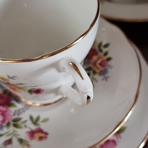 401 - A collection of twenty Dutchess bone china with a floral decoration.