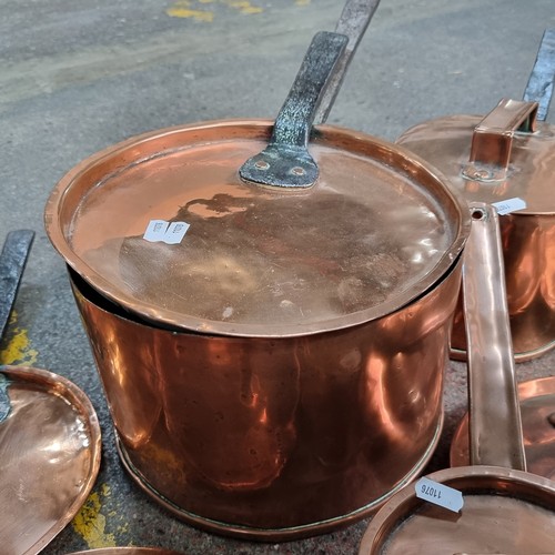 707 - Three antique heavy solid copper Pots and two frying pans all with cast metal handles..  Great looki... 