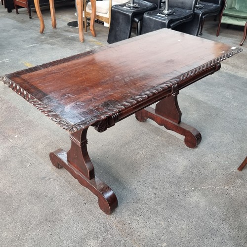 671 - An elegant Victorian console table with carved border, two drawers to the front, and a stretcher bet... 