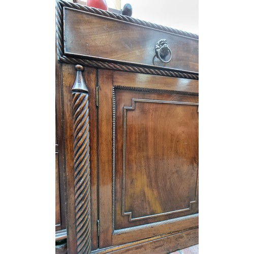 271 - Star Lot : A large Georgian mahogany sideboard with rope twist columns and border. Featuring a singl... 