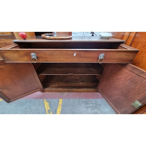 271 - Star Lot : A large Georgian mahogany sideboard with rope twist columns and border. Featuring a singl... 