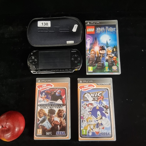 130 - A fun lot consisting of a Sony PlayStation Portable (PSP) console in a carry case. Along with three ... 