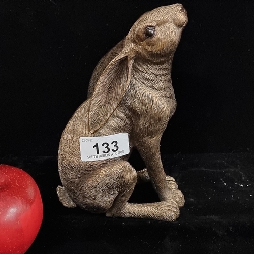 133 - A highly charming figure of a seated hare: a finely detailed and wonderfully expressive piece. In sh... 