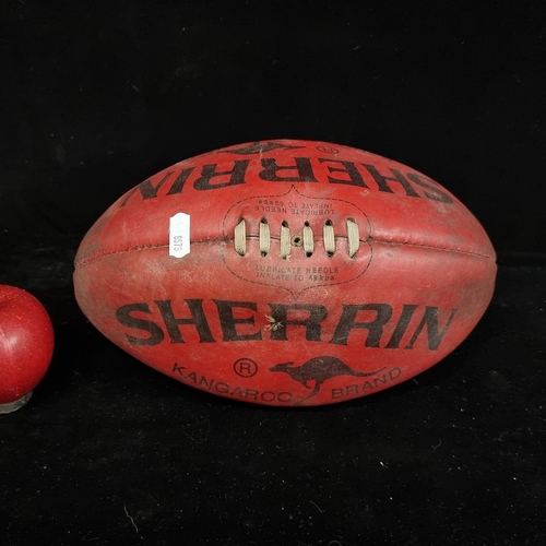 144 - A genuine leather, Australian-made Sherrin Kangaroo Brand red rugby ball. 

Sherrin is a brand of fo... 