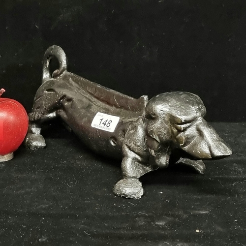 148 - A very heavy cast iron boot scraper in the form of a Dachshund dog - a charming and functional piece... 