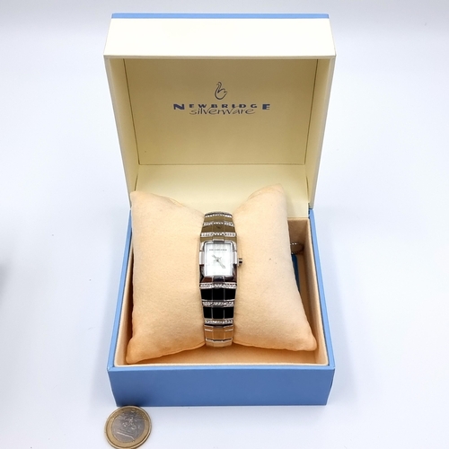 24 - An attractive as new Newbridge Silverware watch, with a stylish associated bracelet. In original pre... 