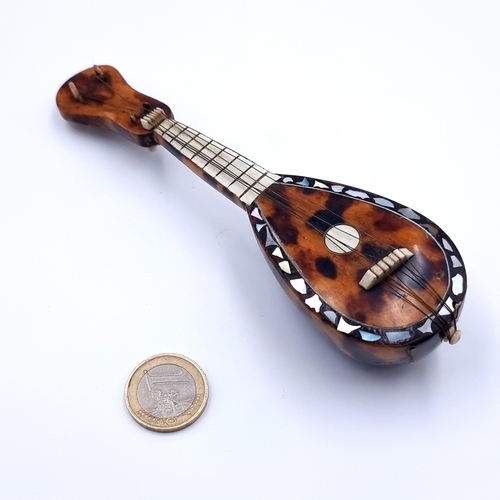 33 - A miniature antique Tortoiseshell Mandolin, with Mother of Pearl inlay and original strings intact. ... 
