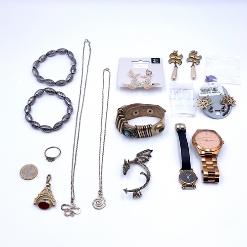 42 - A collection of assorted jewellery, of interest is a Cornelian tri-stone fob, a dragon brooch and a ... 