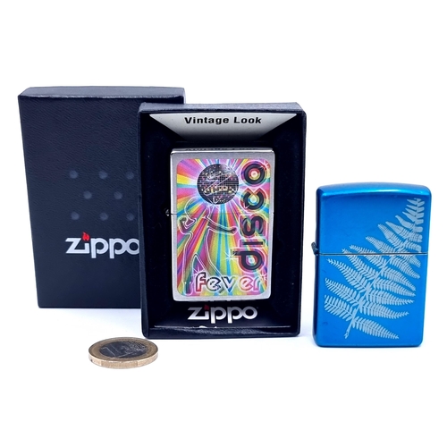 43 - Two Zippo lighters including a boxed disco example.