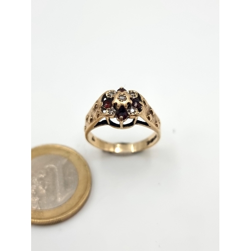 530 - A fine example of an antique 9 carat Gold Ruby and Diamond ring, with wide set shoulders. Ring size:... 