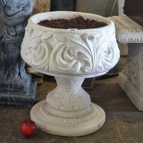 580 - A large reconstituted stone planter with foliate design, in a white finish.