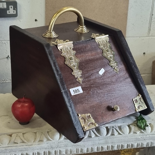 585 - An elegant Edwardian coal scuttle with Egyptian brass details, containing original liner.