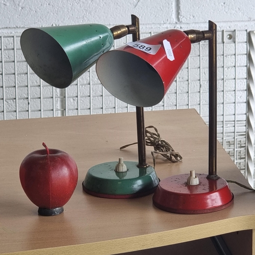 589 - Star Lot : A stunning pair of mid century adjustable desk lamps, with brass features. In red and gre... 