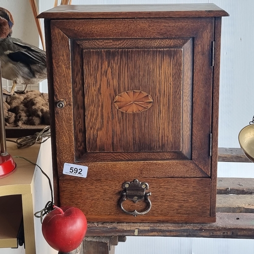 592 - A fabulous Edwardian oak smoker's compendium with inlay cartouche. In great condition.